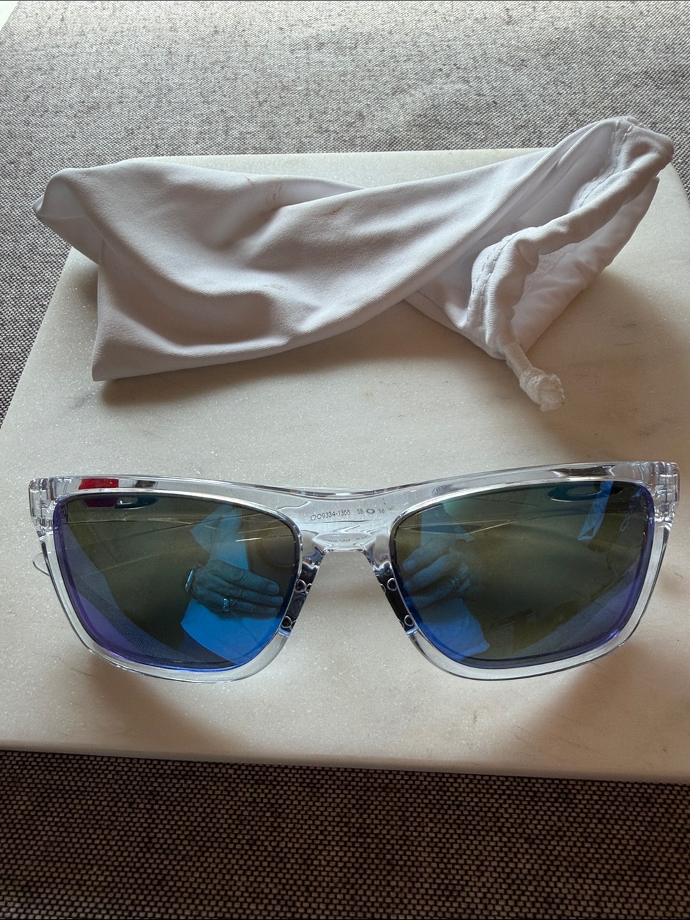Oakley Clear Frame Sunglasses with Blue Mirrored Lenses